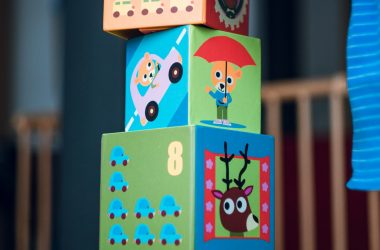 child building an four boxes